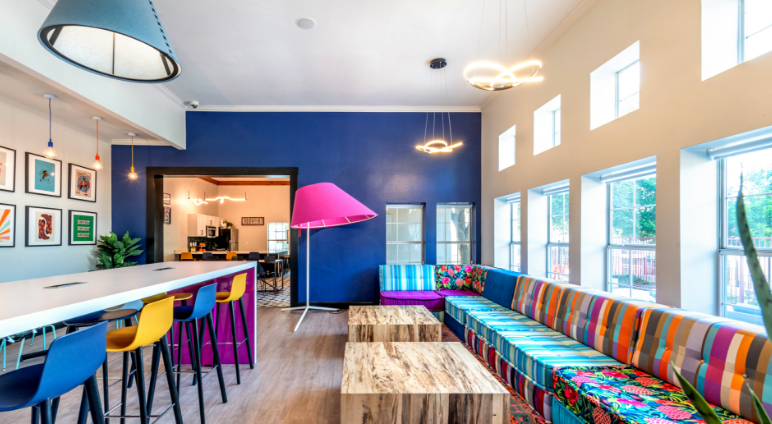 Clubhouse lounge with eclectic colorful seating and decor