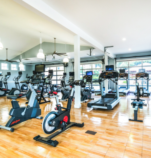 Fitness center with treadmills, ellipticals, and stationery bikes