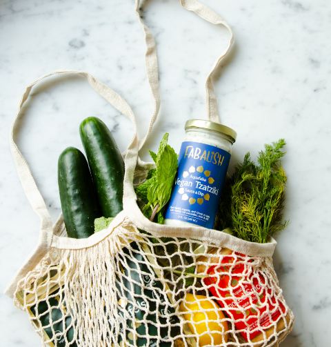 Grocery bag with vegetables and cans